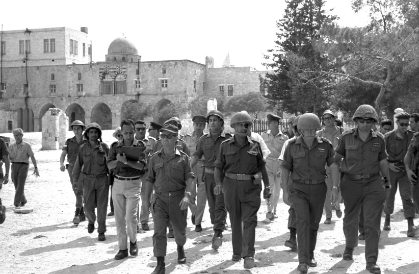  ‘STATUS QUO’ creator: Defense minister Moshe Dayan (2nd from L.) walks through the Old City during the Six Day War, 1967, accompanied by chief of staff Yitzhak Rabin, Gen. Rehavam Ze’evi and Gen. Uzi Narkiss. (credit: GPO FLICKR)
