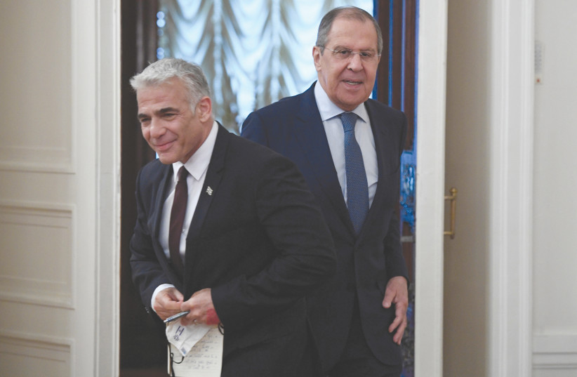  FOREIGN MINISTER Yair Lapid and his Russian counterpart, Sergei Lavrov, meet in Moscow last month.  (photo credit: ALEXANDER NEMENOV/POOL VIA REUTERS)