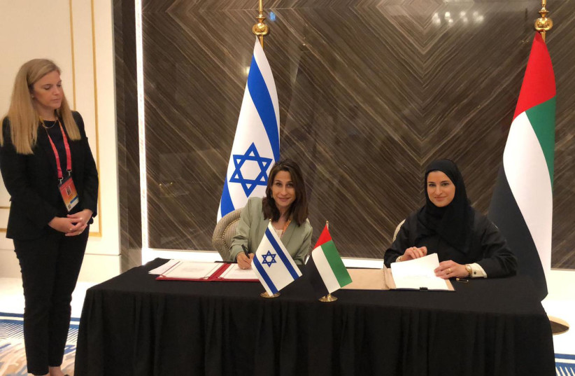  Israel’s Minister of Science, Technology and Space Orit Farkash and the UAE’s Minister of State for Advanced Technology Sarah Al Amiri signed the historic agreement together at Expo 2020’s World Space Week (photo credit: MINISTRY OF SCIENCE AND TECHNOLOGY)