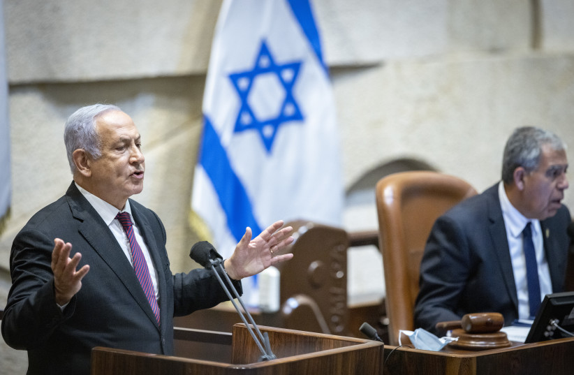  Head of Opposition Benjamin Netanyahu speaks during memorial ceremony marking 26 years since the assassination of former Israeli Prime Minister Yitzhak Rabin, at the Knesset, Israel's parliament, in Jerusalem on October 18, 2021. (credit: OLIVIER FITOUSSI/FLASH90)