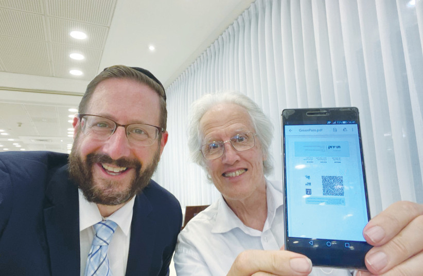 KEVIN DEAN (right) with former MK Rabbi Dov Lipman, who helped him get his Green Pass. (photo credit: Courtesy)