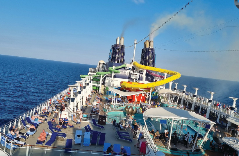 With its water-slides, Jacuzzis, and mini-pools, the top deck of the ‘Epic’ is fun for the whole family. (credit: NOA AMOUYAL)