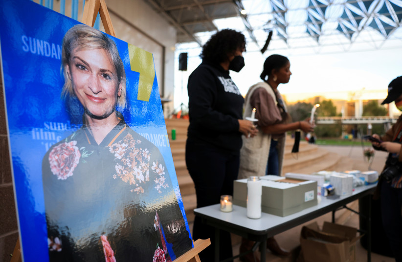  An image of cinematographer Halyna Hutchins, who died after being shot by Alec Baldwin on the set of his movie ''Rust'', is displayed at a vigil in her honour in Albuquerque, New Mexico, US, October 23, 2021. (credit: REUTERS/KEVIN MOHATT)