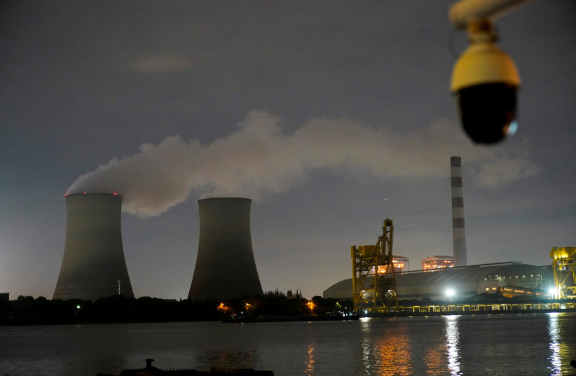  A surveillance camera is seen near a coal-fired power plant in Shanghai (credit: REUTERS/ALY SONG/FILE PHOTO)