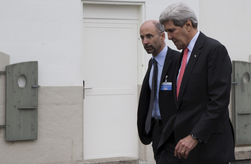  United States Secretary of State John Kerry walks to lunch with members his negotiating team, including Robert Malley (L) from the US National Security Council, following a meeting with Iran's Foreign Minister Javad Zarif over Iran's nuclear program in Lausanne March 20, 2015. (credit: REUTERS/BRIAN SNYDER)