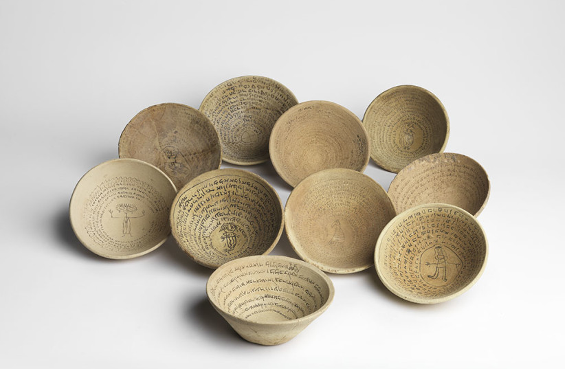  Magic bowls from present-day Iraq, which date back to the fifth- to seventh-century Iraq CE. From the Gil Davidovich Collection, Petah Tikva; The Wolf Family Collection, Jerusalem; Cindy and David Sofer Collection, London. (credit: ELIE POSNER / ISRAEL MUSEUM)