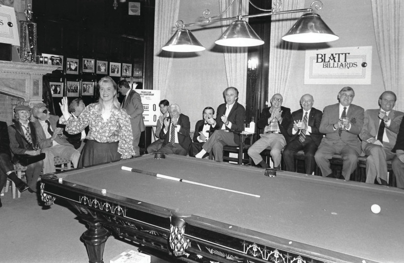  JoAnn Mason Parker at a 1992 exhibition in New York City, with her husband, Robert Parker, clapping with Mayor Ed Koch and other members of the Friars Club. (credit: Courtesy of J. The Jewish News of Northern California via JTA)