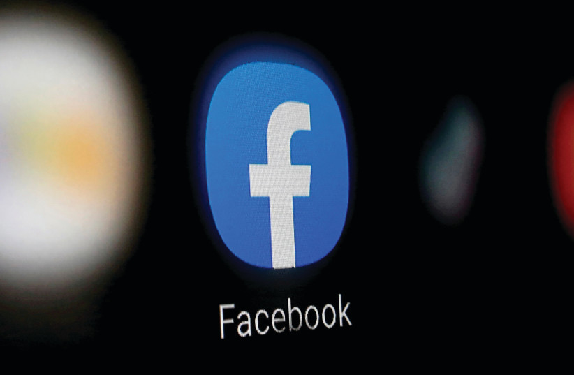  FACEBOOK HAS almost halved the amount of hate speech people see on the social networking site over the last three quarters, down to 0.05% of content views, according to the author. (photo credit: DADO RUVIC/REUTERS)