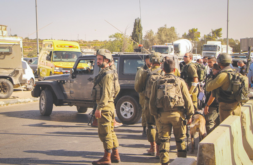 SECURITY FORCES at the Gush Eztion junction. (photo credit: GERSHON ELINSON/FLASH90)