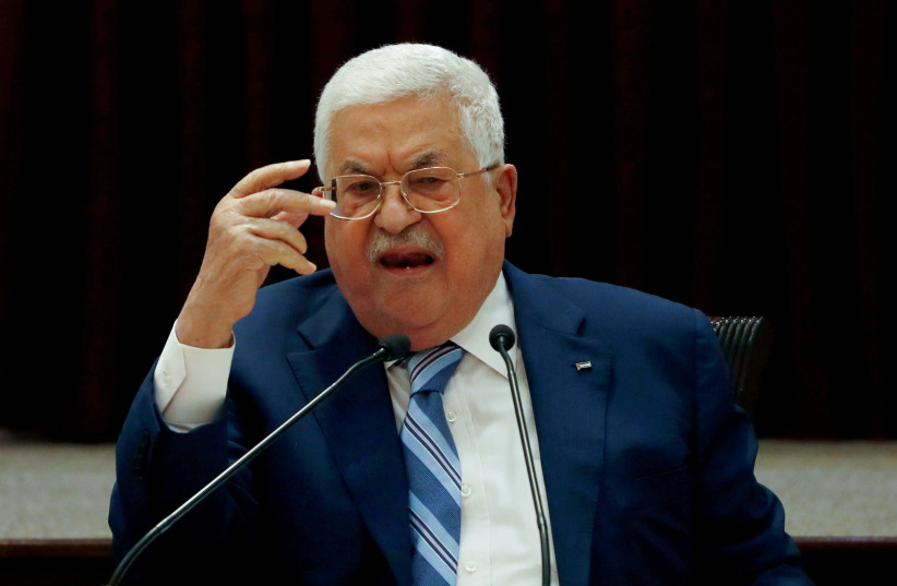  President Mahmoud Abbas gestures during a meeting in Ramallah, in the Israeli-occupied West Bank August 18, 2020.  (photo credit: REUTERS/MOHAMAD TOROKMAN)