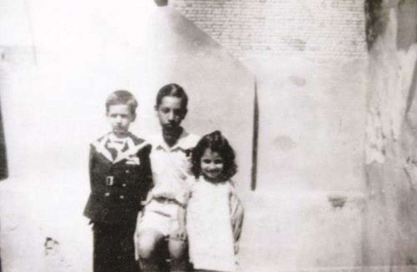  A photograph taken in Baghdad, Iraq, showing Baruch Meiri and some of his siblings. (credit: BABYLONIAN JEWRY HERITAGE CENTER)