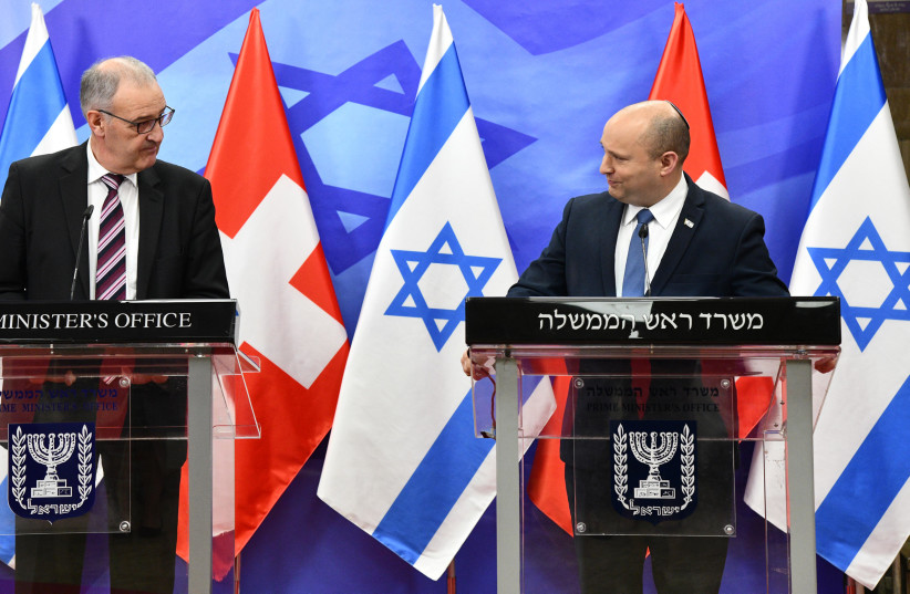  Prime Minister Naftali Bennett meeting with Swiss President Guy Parmelin, Octobder 28, 2021. (photo credit: CHAIM TZACH/GPO)