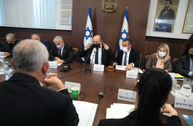  Prime Minister Naftali Bennett convenes the weekly cabinet meeting at the Prime Minister’s Office in Jerusalem on October 17. (credit: sebastian scheiner/pool)