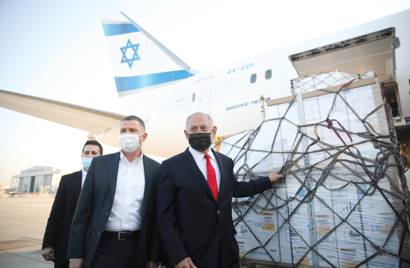  Yuli Edelstein, who was then the minister of health, joined prime minister Benjamin  Netanyahu to greet a plane with a shipment of Pfizer-BioNTech vaccines, at Ben-Gurion  Airport on January 10. (credit: MOTTI MILLROD/REUTERS)