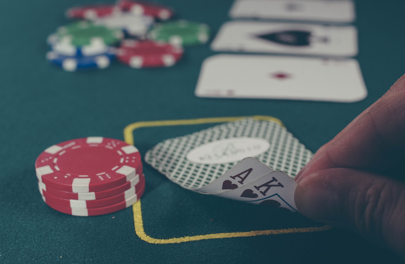  Gambling on poker (Illustrative) (photo credit: UNSPLASH)