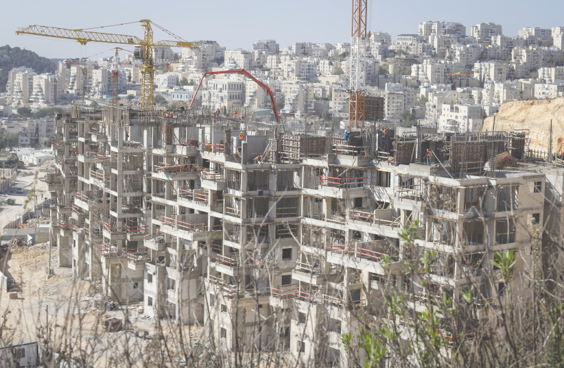 NEW BUILDINGS go up in Modi’in Illit earlier this year. (photo credit: FLASH90)