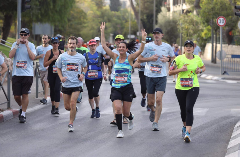  RUNNERS IN Jerusalem's 10th Annual Marathon, October 29, 2021 (credit: MARC ISRAEL SELLEM/THE JERUSALEM POST)