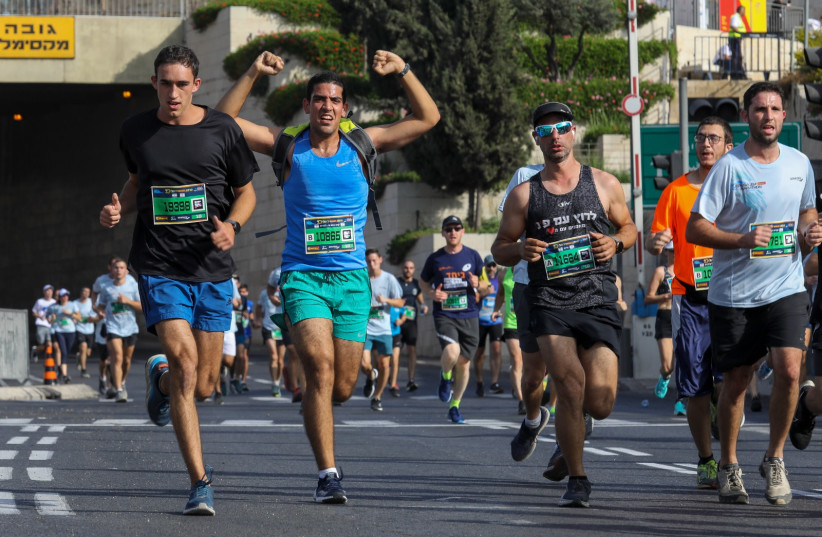  RUNNERS TAKE PART in Jerusalem's 10th Annual Marathon, October 29, 2021 (credit: MARC ISRAEL SELLEM/THE JERUSALEM POST)