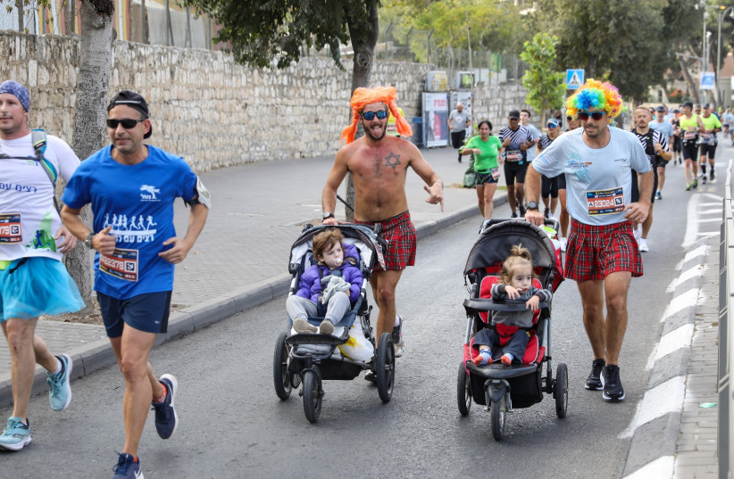  RUNNERS TAKE PART in Jerusalem's 10th Annual Marathon, October 29, 2021 (credit: MARC ISRAEL SELLEM/THE JERUSALEM POST)