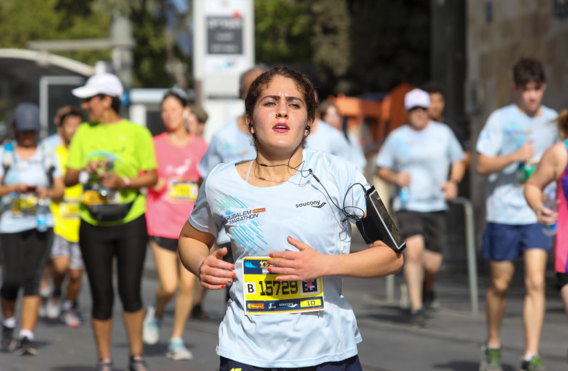 A RUNNER takes part in Jerusalem's 10th Annual Marathon, October 29, 2021 (credit: MARC ISRAEL SELLEM/THE JERUSALEM POST)