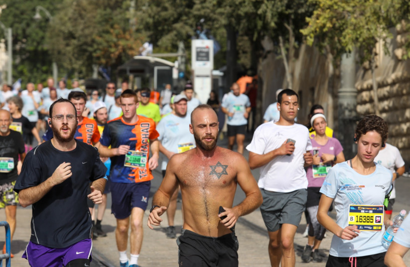 RUNNERS TAKE PART in Jerusalem's 10th Annual Marathon, October 29, 2021 (credit: MARC ISRAEL SELLEM/THE JERUSALEM POST)