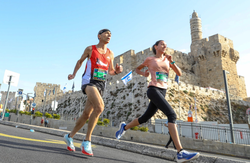RUNNERS TAKE PART in the Jerusalem 10th Annual Marathon, October 29, 2021 (credit: MARC ISRAEL SELLEM/THE JERUSALEM POST)