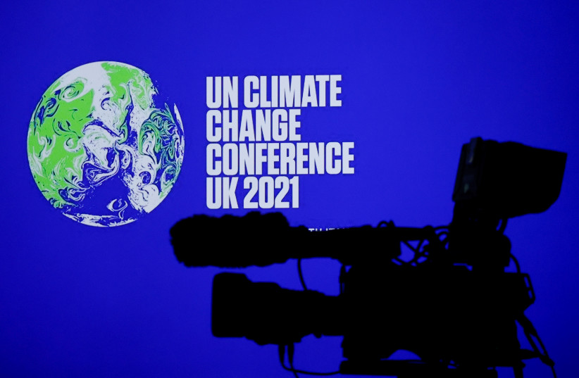 A TV camera is pictured during the UN Climate Change Conference (COP26) in Glasgow, Scotland, Britain October 31, 2021. (credit: PHIL NOBLE/REUTERS)