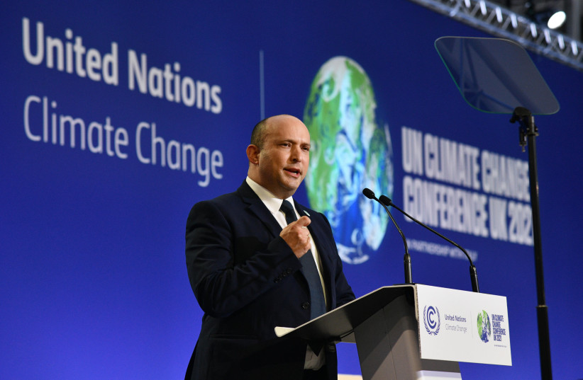  Prime Minister Naftali Bennett speaking at the COP26 climate conference in Glasgow, November 1, 2021.  (credit: CHAIM TZACH/GPO)
