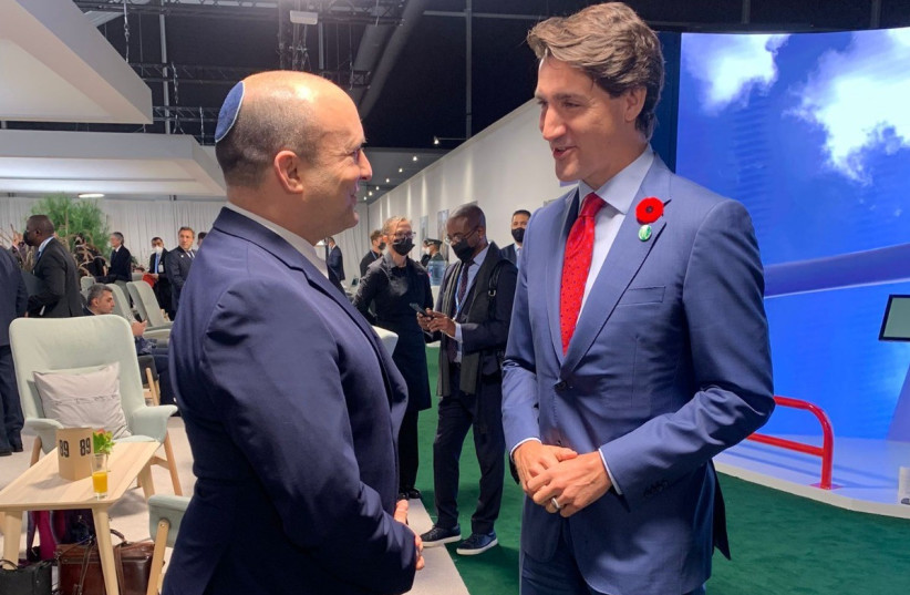  Prime Minister Naftali Bennett and Canadian Prime Minister Justin Trudeau at the COP26 climate conference in Glasgow, November 1, 2021. (photo credit: COURTESY)