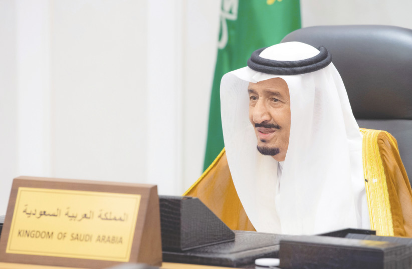  SAUDI KING Salman bin Abdulaziz delivers a speech by video to the G20 summit, held in Rome from Riyadh on Saturday. (photo credit: BANDAR ALGALOUD / SAUDI ROYAL COURT / REUTERS)