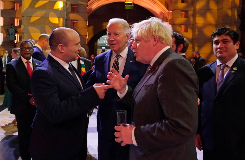  Israel's Prime Minister Naftali Bennett, U.S. President Joe Biden and Britain's Prime Minister Boris Johnson chat as they attend an evening reception to mark the opening day of the UN Climate Change Conference (COP26), in Glasgow, Scotland, Britain November 1, 2021.  (credit:  ALBERTO PEZZALI/POOL VIA REUTERS)