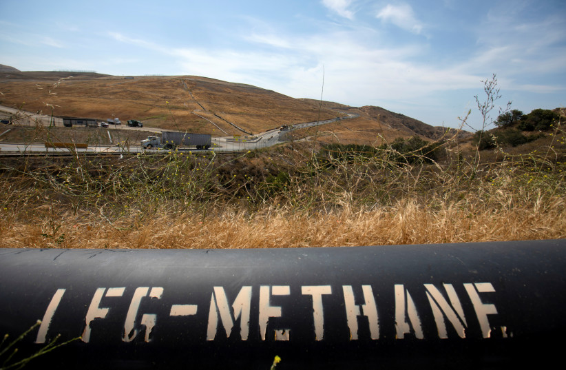   A pipeline that moves methane gas from the Frank R. Bowerman landfill to an onsite power plant is shown in Irvine, California, US (photo credit: MIKE BLAKE/REUTERS)