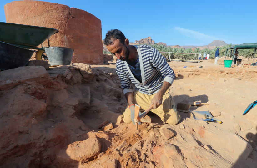  An archaeologist carefully cleans the pottery to examine the findings known to be from Dadan and Lihyan civilisation dated back to the second half of the first millennium BC, in Al-Ula, Saudi Arabia (photo credit: AHMED YOSRI/ REUTERS)