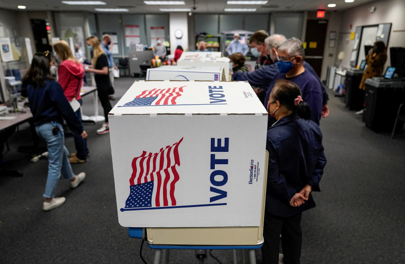  People vote on the last day of early voting in the Virginia gubernatorial election in Fairfax, Virginia, October 30, 2021 (photo credit: JOSHUA ROBERTS / REUTERS)