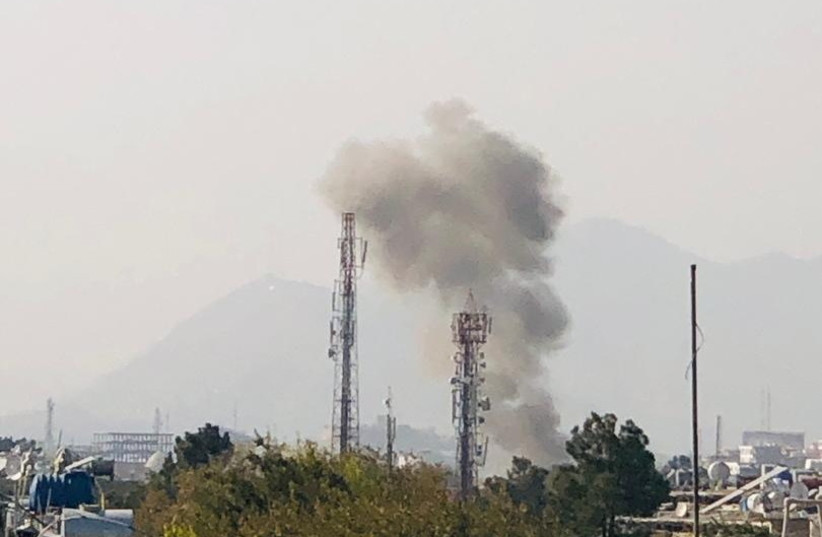  Smoke billows near the Sardar Mohammad Daud Khan National Military Hospital after an explosion in central Kabul, Afghanistan November 2, 2021 (credit: HANDOUT/REUTERS)