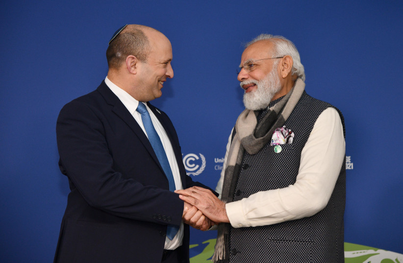  PM Naftali Bennett with Indian PM Narendra Modi at the COP26 climate conference in Glasgow (credit: CHAIM TZACH/GPO)
