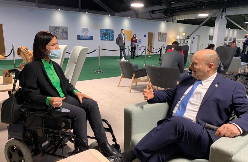  Energy Minister Karin Elharrar speaks with Prime Minister Naftali Bennett on the sidelines of the UN Climate Change Conference (COP26). (photo credit: Courtesy)