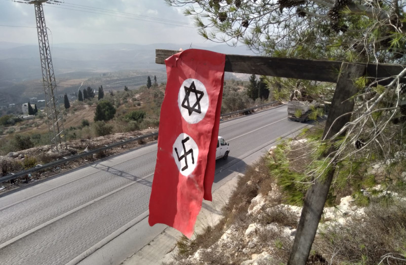  A handmade Nazi flag with a Jewish Star of David was hung up near the entrance to Homesh (photo credit: HOMESH YESHIVA)