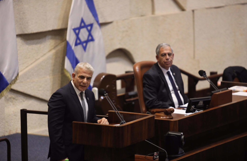 Foreign Minister Yair Lapid (L) and Knesset Speaker Mickey Levy (R), 3 November 2021. (photo credit: MARC ISRAEL SELLEM)
