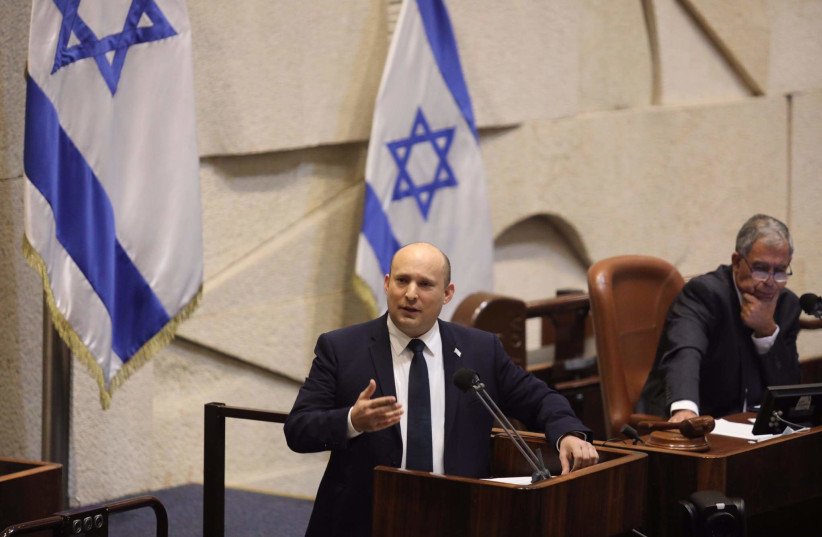 Prime Minister Naftali Bennett (L) and Knesset Speaker Mickey Levy (R), 3 November 2021. (photo credit: MARC ISRAEL SELLEM)