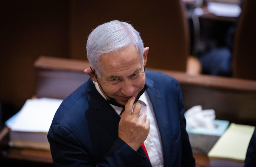  Benjamin Netanyahu attends a plenum session and a vote on the state budget at the assembly hall of the Israeli parliament, in Jerusalem on November 3, 2021 (credit: OLIVIER FITOUSSI/FLASH90)