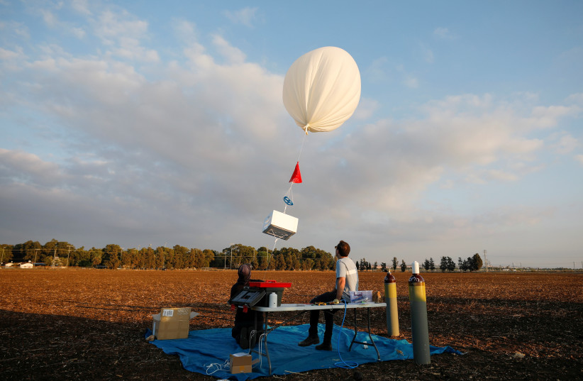  A balloon is seen during a demonstration by Israeli startup High Hopes Labs who are developing a balloon that captures carbon directly from the atmosphere at high altitude, in Petah Tikva, Israel November 3, 2021 (credit: REUTERS/AMIR COHEN)