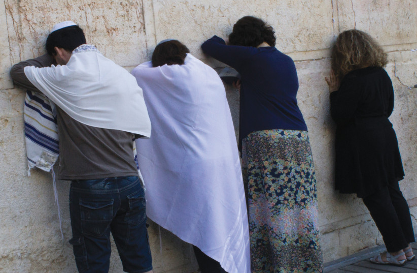  PRAYING AT Robinson’s Arch at the south end of  the Kotel, the section set aside for pluralistic prayer.  (photo credit: ROBERT SWIFT/FLASH90)