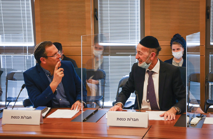  MK MOSHE TUR-PAZ (Yesh Atid, on left) with haredi MK Uri Maklev (United Torah Judaism): Earthquake.  (credit: KNESSET SPOKESPERSON'S OFFICE)