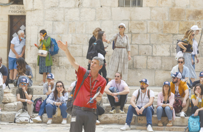 A GROUP OF French tourists and their guide in Jerusalem’s Old City this week. (photo credit: MARC ISRAEL SELLEM/THE JERUSALEM POST)