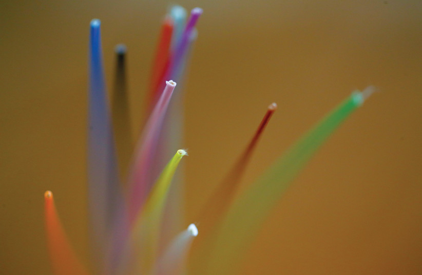  FIBER OPTICS of a cable without sheath. (photo credit: REUTERS/ALESSANDRO BIANCHI)