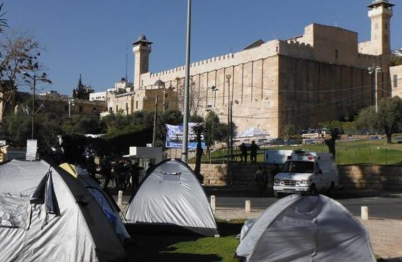  TENTS COVER every possible inch  around Ma’arat Hamachpela.  (photo credit:  Courtesy Chabad Hebron)