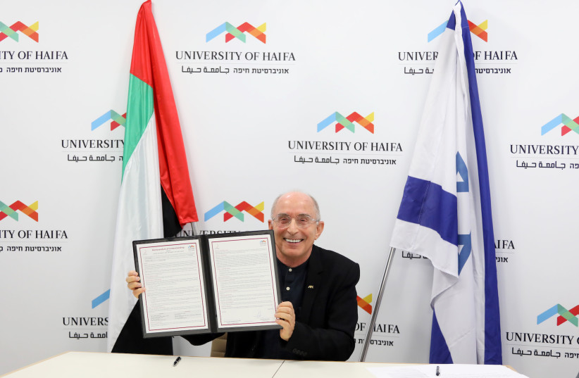 University of Haifa president Prof. Ron Robin presents the University's MOU agreement with the UAE’s Zayed University. (credit: UNIVERSITY OF HAIFA)