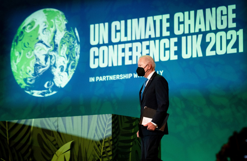US President Joe Biden walks to deliver a speech during ''Action on Forests and Land-Use'' event at the UN Climate Change Conference (COP26) in Glasgow, Scotland, Britain, November 2, 2021 (credit: REUTERS)