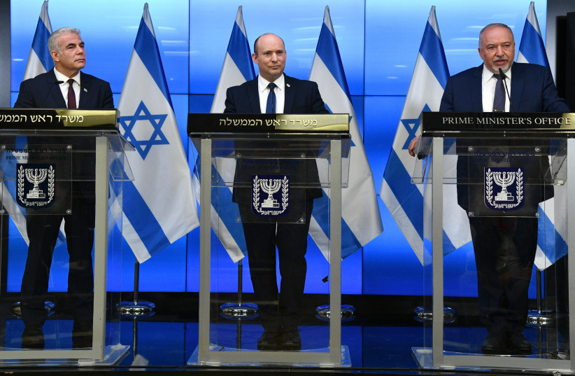  Prime Minister Naftali Bennett, Foreign Minister Yair Lapid, and Finance Minister Avigdor Liberman at a joint press conference, November 6, 2021 (credit: HAIM ZACH/GPO)